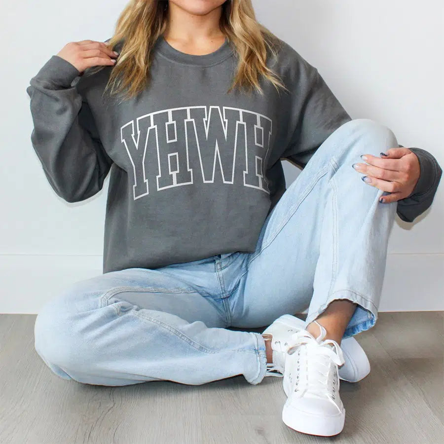 Womens Model Wearing Charcoal YHWH Unisex Sweatshirt