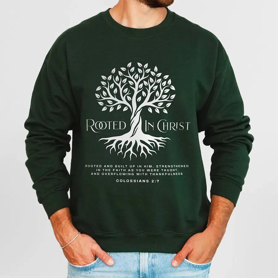 Mens Model Wearing Forest Rooted in Christ Unisex Sweatshirt