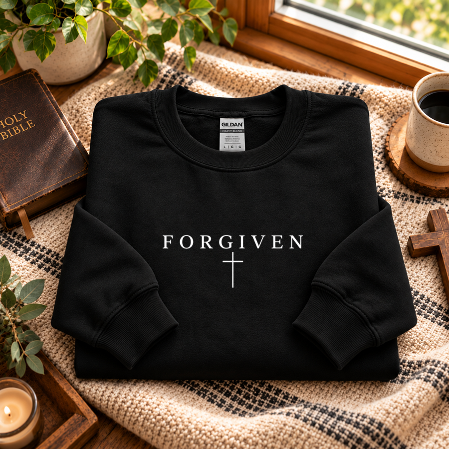 Forgiven Christian sweatshirt in black - flat lay
