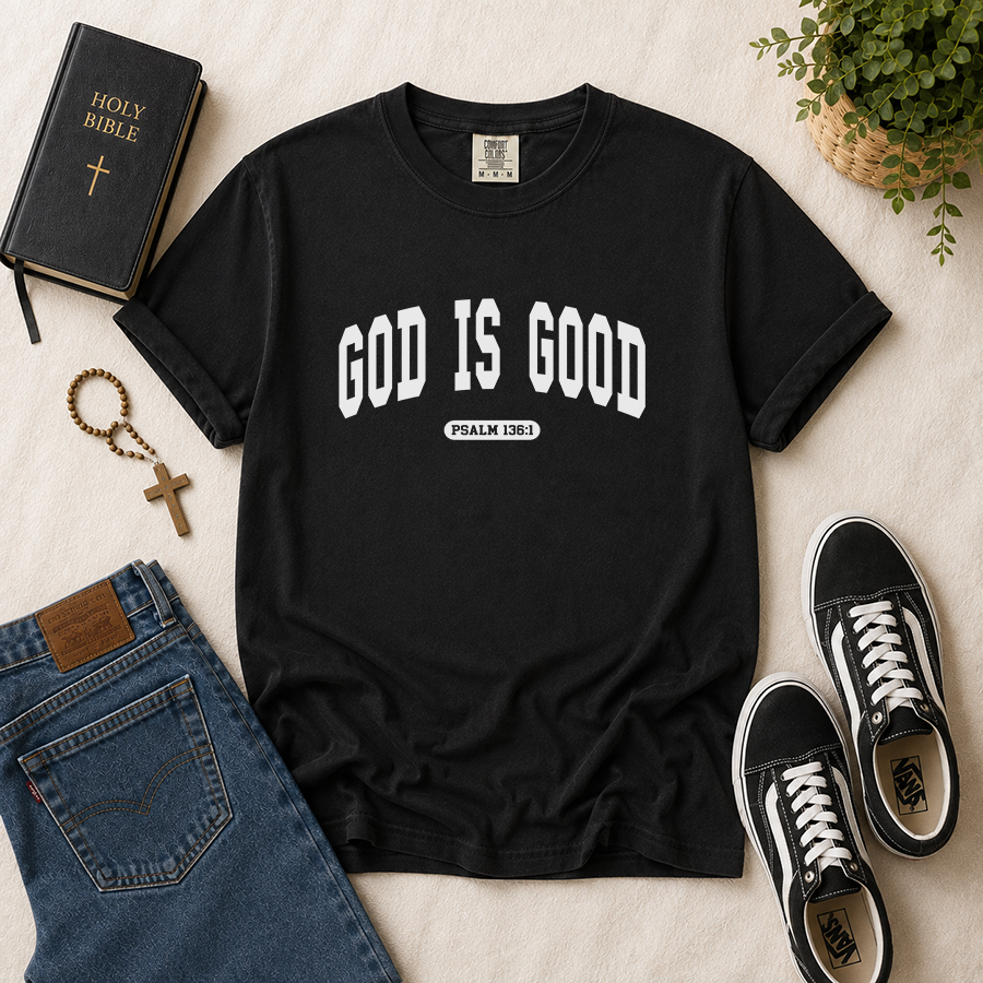 God Is Good Psalm 136:1 Christian T-Shirt in Black – Bible Verse Shirt Flat Lay